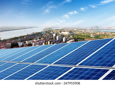 Aerial View Of The City And The Tower On Top Of The Solar Panel