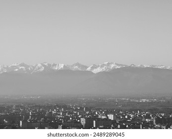 Aerial view of the city of Turin, Italy with Alps mountain range in the background in black and white - Powered by Shutterstock