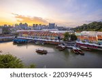 Aerial view cityscape of Clarke Quay, Singapore city skyline at sunset