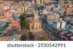 Aerial View of a Classic Church Amidst Modern Buildings in Bogotá, Colombia