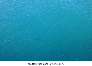 Aerial view of a clear sea water texture. Natural blue background. Blue water reflection. Mediterranean sea. - Powered by Shutterstock