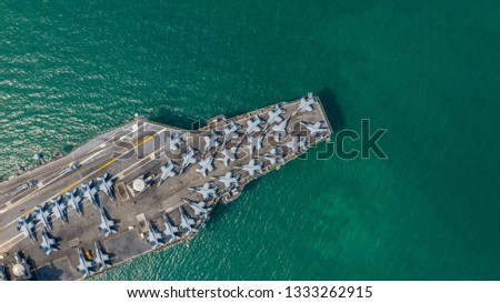 Aerial view close up USA warship navy nuclear aircraft carrier, America military navy ship airplane carrier full loading plane fighter jet aircraft in open ocean, United States of America.