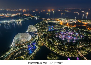 Aerial View To Cloud Forest And Flower Dome Illuminated At Night. Gardens By The Bay, Singapore City