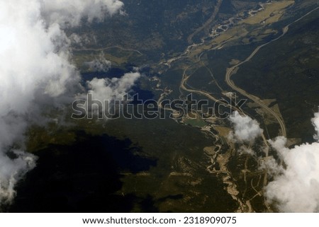 Aerial view of clouds in the blue sky at high altitude.