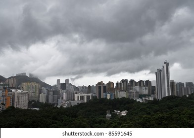 An Aerial View Of A Cloudy And Rainy Day Of The Overpopulated Hong Kong City Skyline