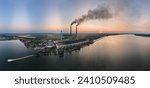 Aerial view of coal power plant high pipes with black smokestack polluting atmosphere. Electricity production with fossil fuel concept