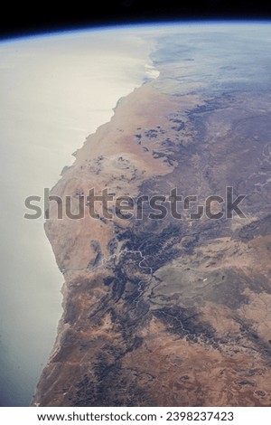 Aerial View of Coastal Desert Landscape with Dune Patterns - Namib Desert, Namibia. Elements of this image furnished by NASA