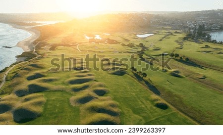 Aerial view of a coastal NSW golf course with its bunkers in the afternoon sunshine.
