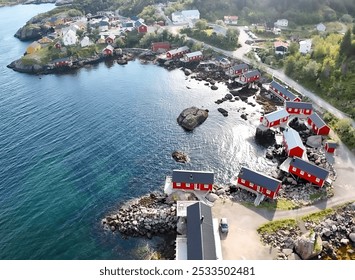 Aerial view of a coastal village with red and white houses on the rocky shore of a clear blue sea in Norway. - Powered by Shutterstock