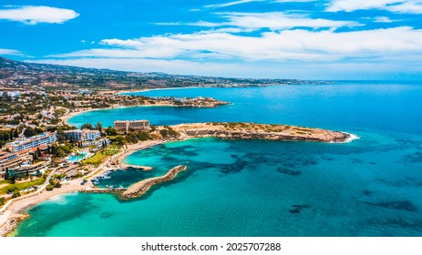 Aerial view of coastline of Cyprus beach.The steep stone cliffs and deep blue sea waves crushing in coves. beautiful turquoise waters of mediterranean. Postcard place, wonderful resort
