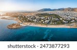 Aerial view of the coastline of Glyfada, south Athens, Greece, with beaches and marinas during summer sunset time