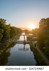 Aerial view colorful dramatic sunrise sky over canal and draw bridge in Belgium  Canals and water for transport  agriculture  Fields   meadows  Landscape  High quality photo