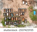 Aerial view of colorful dumpsters arranged in an industrial area.