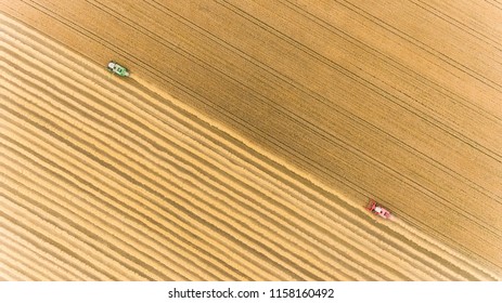 Aerial View Of Combine Harvester Harvesting Hay In Rural Ireland