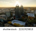Aerial view of commercial buildings in Atlanta Metro Area with sun rays during sunset