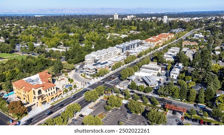 Aerial view of commercial and residential areas of Menlo Park, California toward Palo Alto along El Camino Real Rod near Middle Avenue. Backdrop distant San Francisco Bay and mountains - Powered by Shutterstock