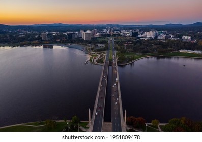 Aerial view of Commonwealth Bridge on Lake Burley Griffin during a beautiful sunset in Canberra, Australia 