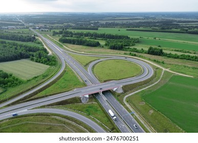 Aerial view of complex highway interchange and surrounding countryside