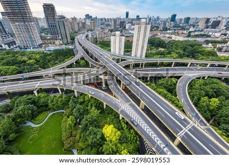 Aerial view of complex highway interchange with buildings in Shanghai 