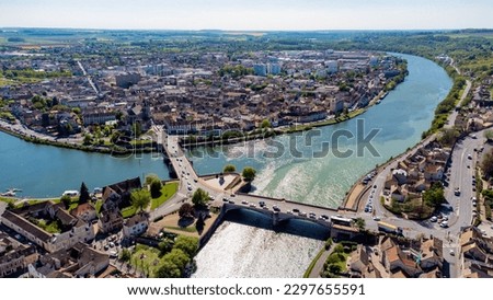 Aerial view of the confluence between the Seine and the Yonne showing different colors of water mixing in the town of Montereau Fault Yonne in Seine et Marne, France