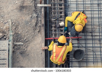 aerial view of construction worker in construction site - Shutterstock ID 1006180303