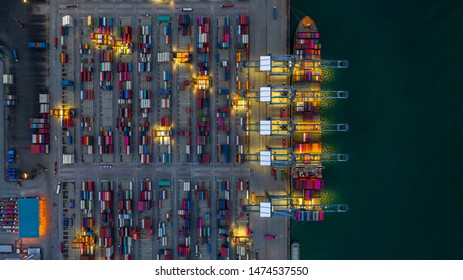 Aerial view container ship loading and unloading at night. - Shutterstock ID 1474537550