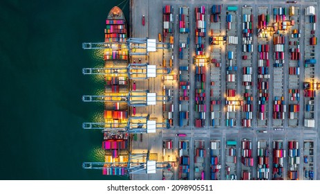 Aerial view container ship working at night, Global business company import export logistic and transportation of international global trading by container cargo freight shipping cargo vessel. - Shutterstock ID 2098905511