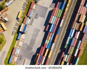 Aerial View Of Container Terminal On A Railway With Open Storage Area. Many Containers Before Transport From Drone View. Industrial Zone From Above In Landscape. Nyrany, Czech Republic, Central Europe