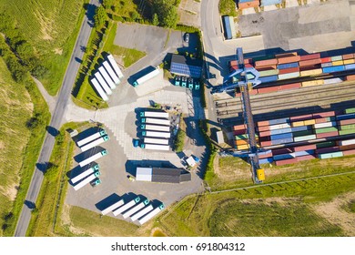 Aerial View Of Container Terminal On A Railway With Open Storage Area. Many Containers Before Transport From Drone View. Industrial Zone From Above In Landscape. Nyrany, Czech Republic, Central Europe