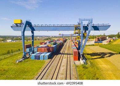 Aerial View Of Container Terminal On A Railway With Open Storage Area. Many Containers Before Transport From Drone View. Industrial Zone From Above In Landscape. Nyrany, Czech Republic, Central Europe