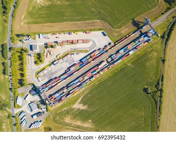 Aerial View Of Container Terminal On A Railway With Open Storage Area. Many Containers Before Transport From Drone View. Industrial Zone From Above In Landscape. Nyrany, Czech Republic, Central Europe