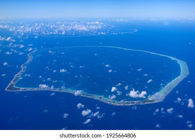 Aerial View Of A Coral Atoll In French Polynesia In The South Pacific Ocean.