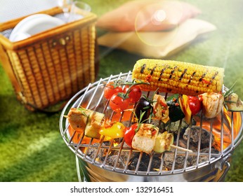 Aerial view of corn cob and vegetarian barbecue on a grilling pan - Powered by Shutterstock