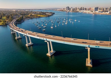 Aerial view of Coronado Bridge in San Diego bay in southern California on a warm sunny day with boats in the bay and cars crossing the bridge - Powered by Shutterstock