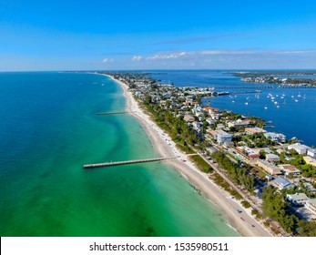 Aerial View Of Cortez Beach Withe Sand Beach And His Little Wood Pier On Blue Water, Anna Maria Island, Florida, USA