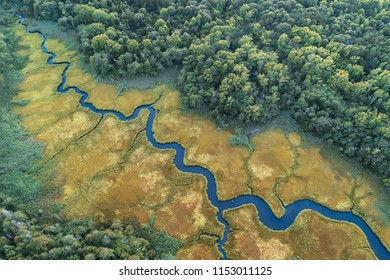 Aerial View Of A Creek In A Salt Marsh