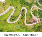 Aerial view of crooked path of road on the mountain, Shot from drone