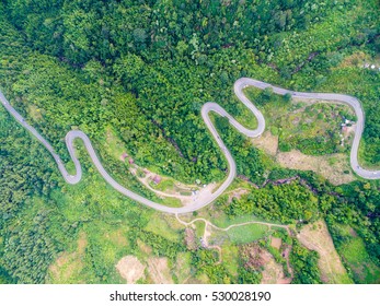 Aerial View Of Crooked Path Of Road On The Mountain, Shot From Drone