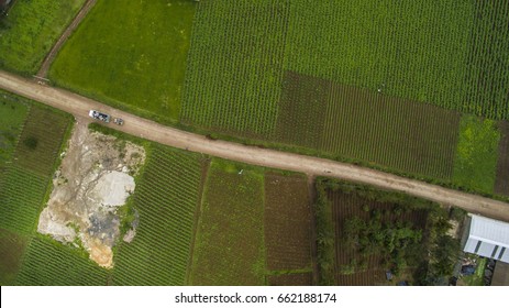 Aerial view of crop fields in Comalapa, Guatemala. Wile a truck was pasing by. 
