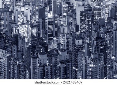 Aerial view of crowded high rise building in Hong Kong city at night - Powered by Shutterstock