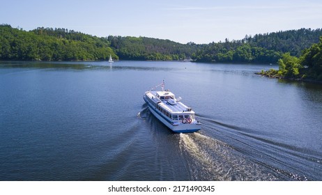Aerial view of  cruise ship on Orlik reservoir. Beautiful cruise on the lake. Orlik nad Vltavou, South Bohemia, Czech republic. - Shutterstock ID 2171490345