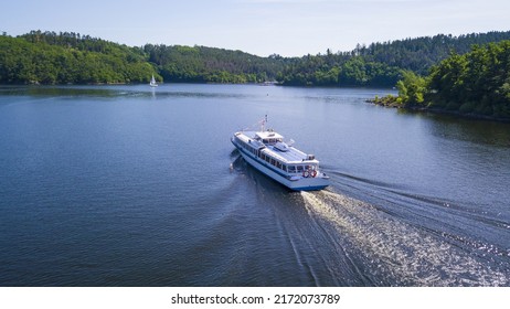 Aerial view of  cruise ship on Orlik reservoir. Beautiful cruise on the lake. Orlik nad Vltavou, South Bohemia, Czech republic. - Shutterstock ID 2172073789