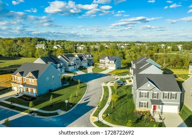 Aerial View Of Cul De Sac Street With Upper Middle Class Luxury Single Family Homes And Cloudy Blue Sky In Maryland USA