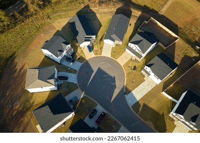 Aerial view of cul de sac at neighbourhood road dead end with densely built homes in South Carolina residential area. Real estate development of family houses and infrastructure in american suburbs