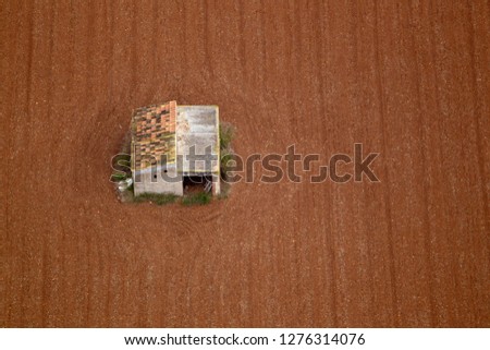 Similar – Image, Stock Photo Combine harvester harvests grain field in the evening light from the air