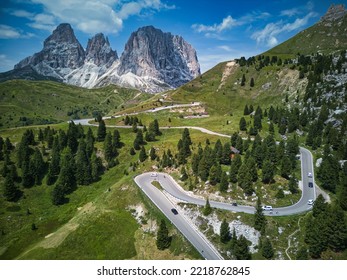 An aerial view of curving roads at Sella Pass in the Dolomites Mountain in Italy