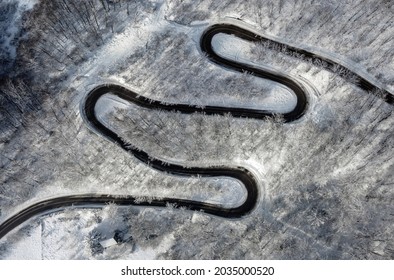 Aerial View Of Curvy Mountain Road In Winter