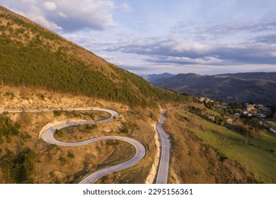 Aerial view of curvy road on slope of monte Nerone in Italy