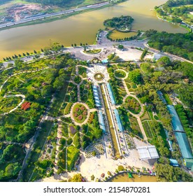 Aerial view of Da Lat city beautiful tourism destination in central highlands Vietnam. Urban development texture, green parks and city lake.