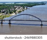 Aerial view of the Dale Gardner Veterans Memorial Bridge over te Mississippi river with the city of Savanna, Illinois in the background
